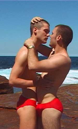 2 guy wearing red speedos.