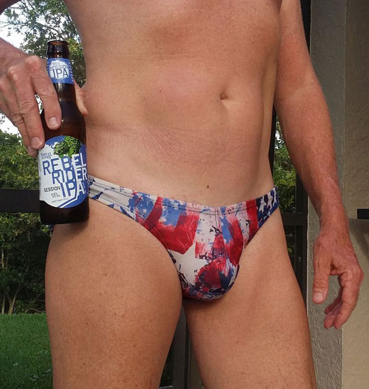 Having a beer in speedos