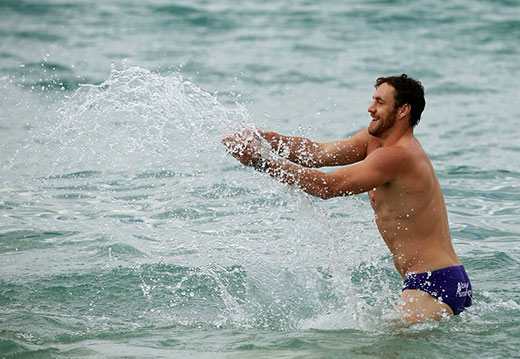 A real man wearing speedos